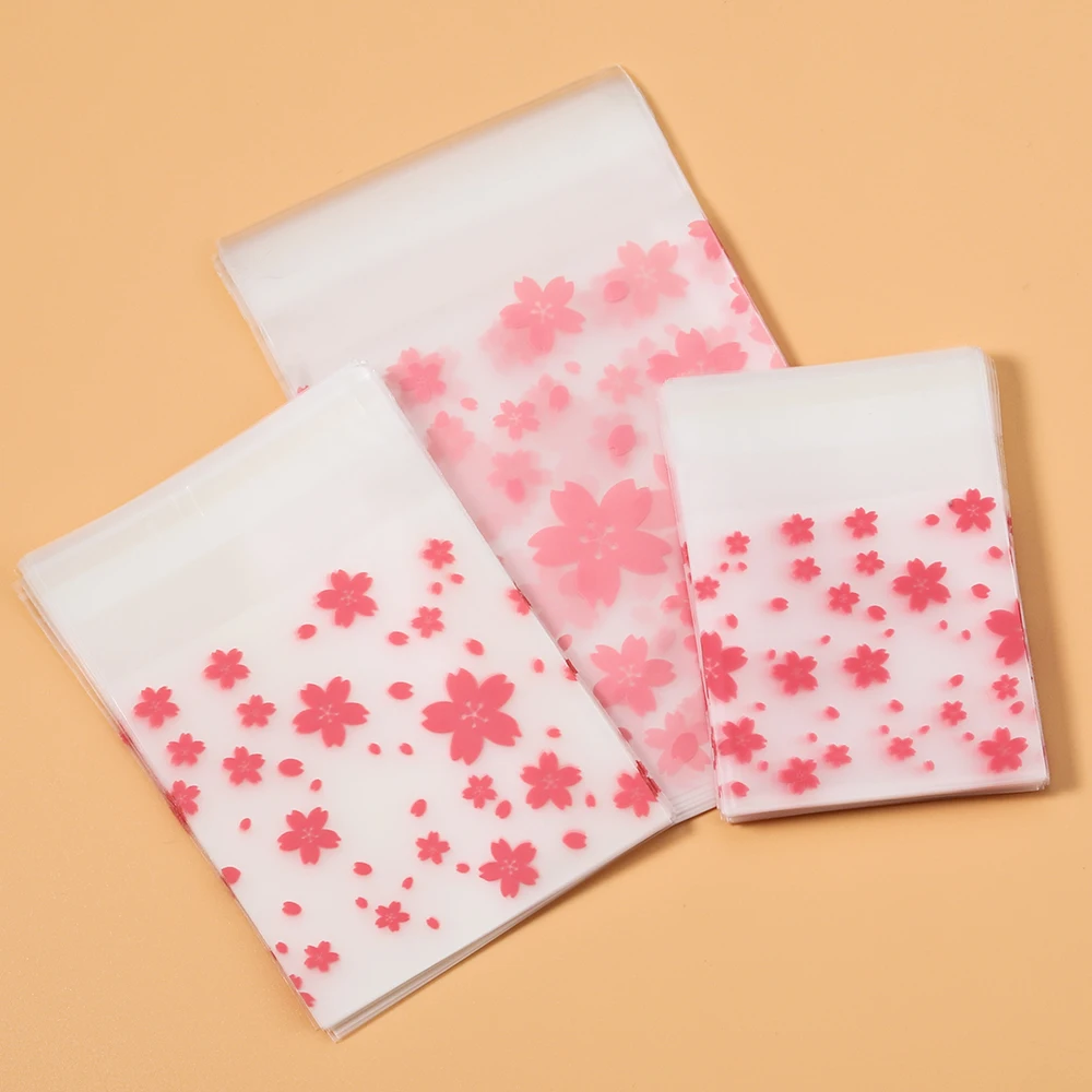 S3d9c7f31bb4c4a93ba5c977ac42250a3R 100 Plastic Packing Bags Flower Self Adhesive Bags OPP Pouches for Jewelry Gifts Biscuits (New) - Image 1